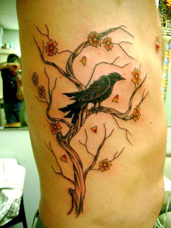 Large Flying Bird And Tree Tattoo On Upperback