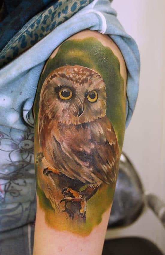 small owl tattoo on shoulder