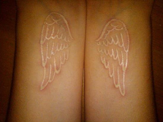 14-White-ink-wing-tattoo