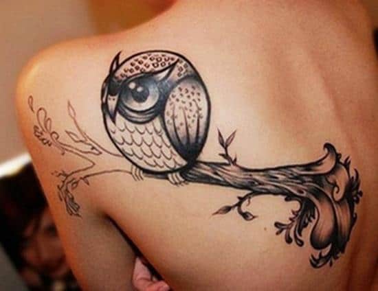 cute owl back tattoo