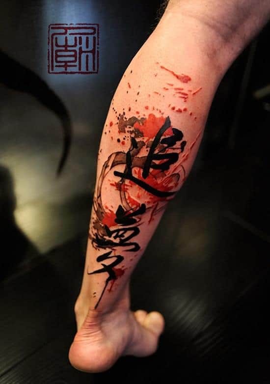 watercolor writing tattoo on leg 21-Felix.-Splattered-leg-tattoo
