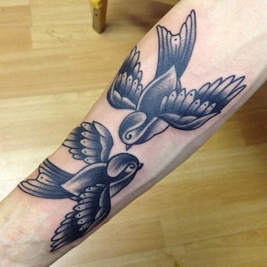 Traditional bird tattoo by Chris Smith TattooNOW