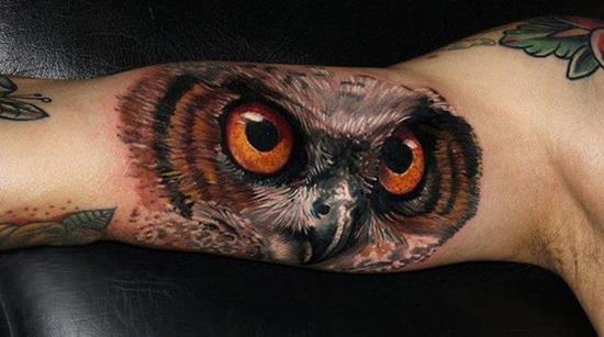 3d bicep owl face tattoo