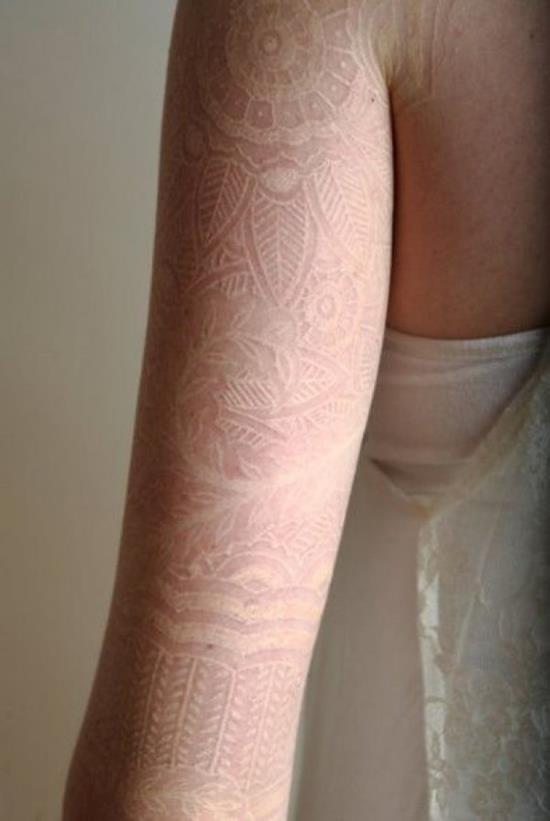 36-White-ink-lace-tattoo-on-arm