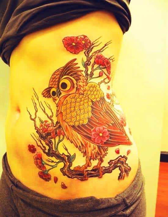 owl tattoo on waist