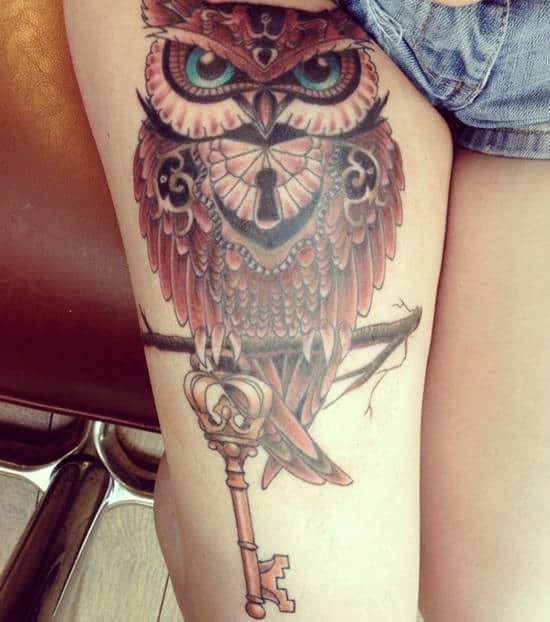 owl and key colored tattoo on thigh girl