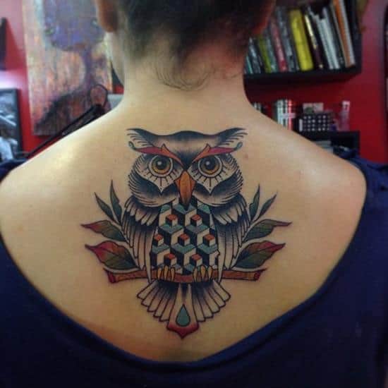 colored owl tattoo on upper back