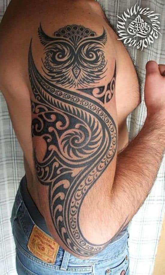 tribal owl arm tattoo