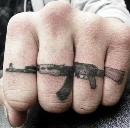 54-gun-finger-tattoo