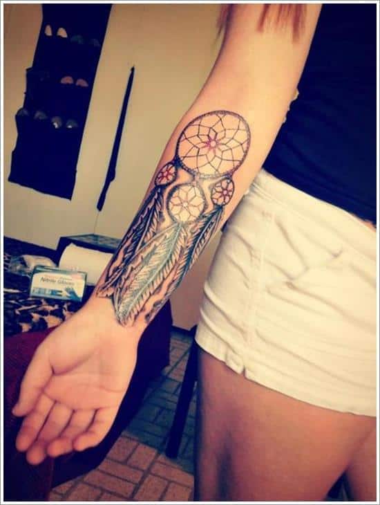 woman's dreamcatcher tattoo on forearm