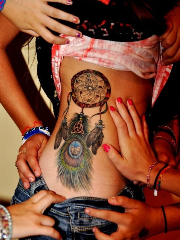 complex Dreamcatcher Tattoo on woman's side