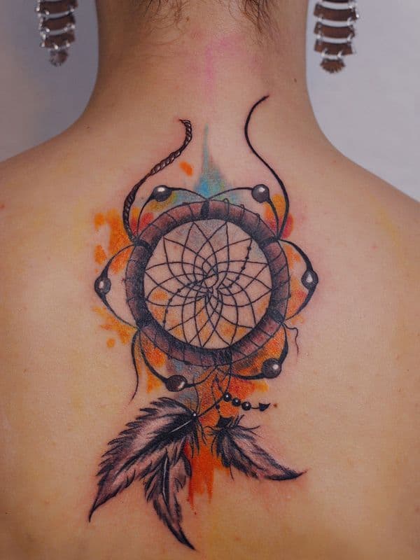 orange Dreamcatcher Tattoo on woman's upper back 