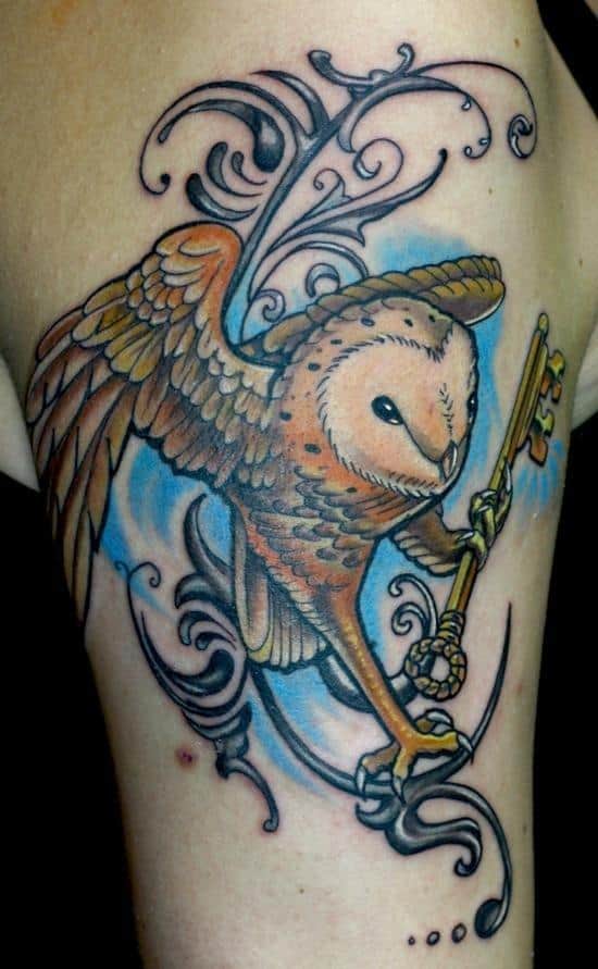 owl in flight with key tattoo