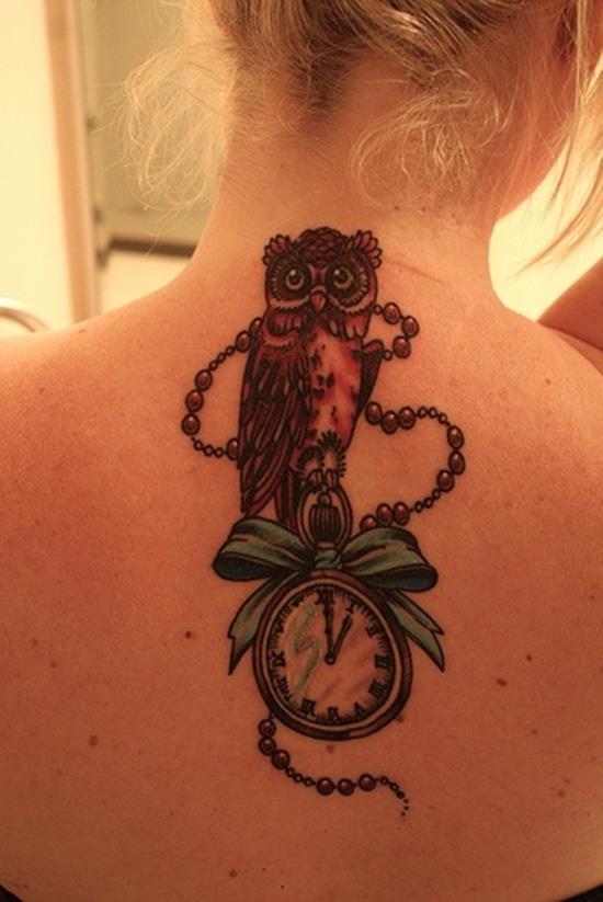 clock and owl tattoo on back