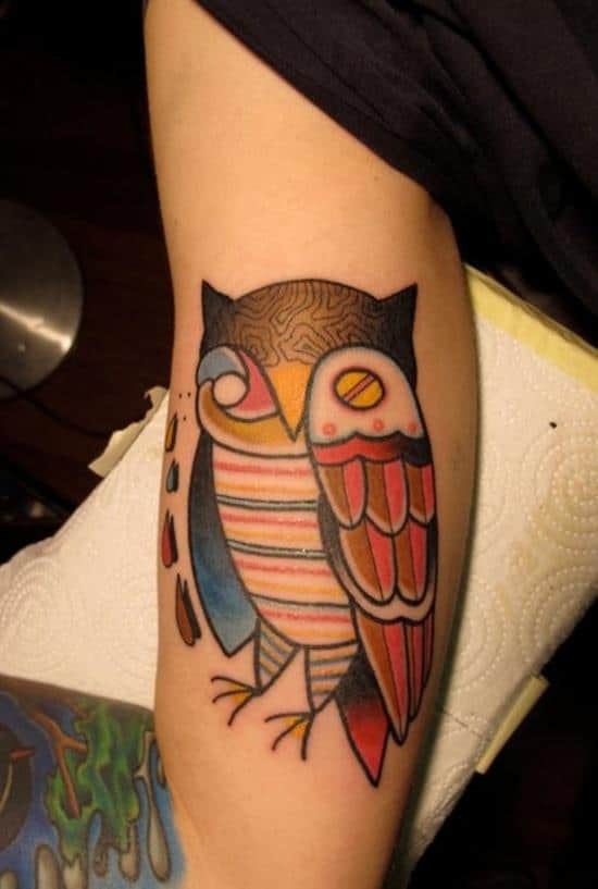 cartoonish owl tattoo