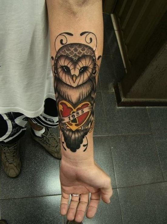 1985 forearm owl tattoo