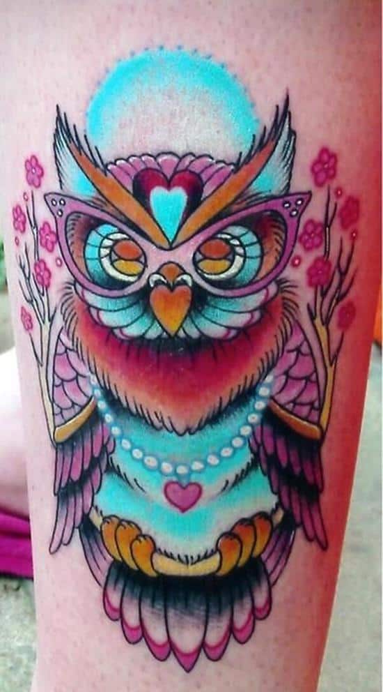 blue owl in glasses and necklace heart tattoo