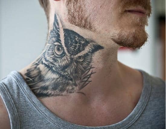 owl face neck tattoo