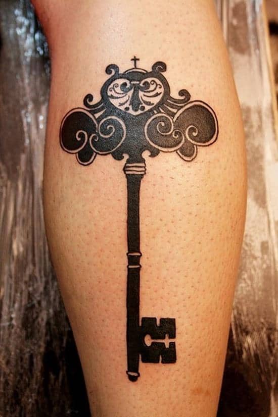 big key and small owl tattoo