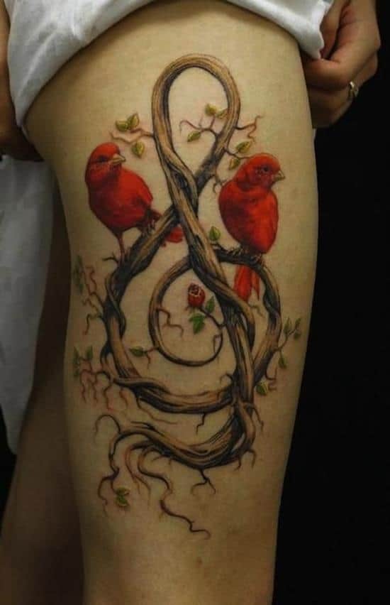 bird and g clef tattoo on leg thigh-tattoo-gcliff