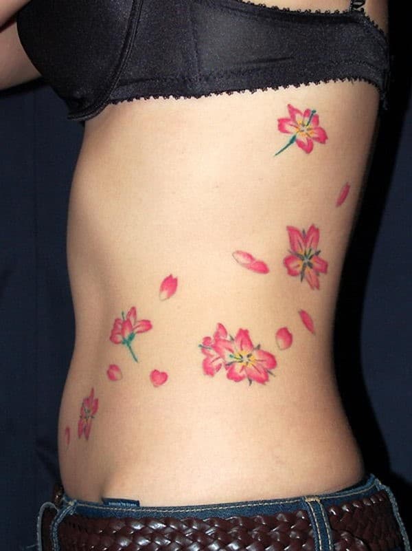 christie yyc tiger flower cherry blossoms red highlights rib womans tattoo  edmonton best 2020  7th Samurai Tattoos