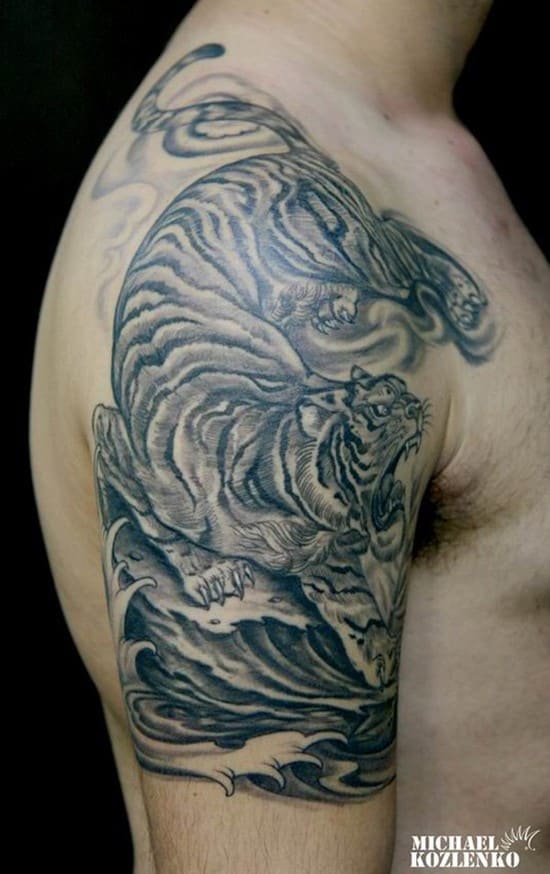 large arm tattoo of asian tiger