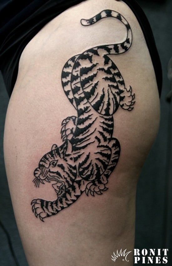 black tattoo design of tiger on upper arm