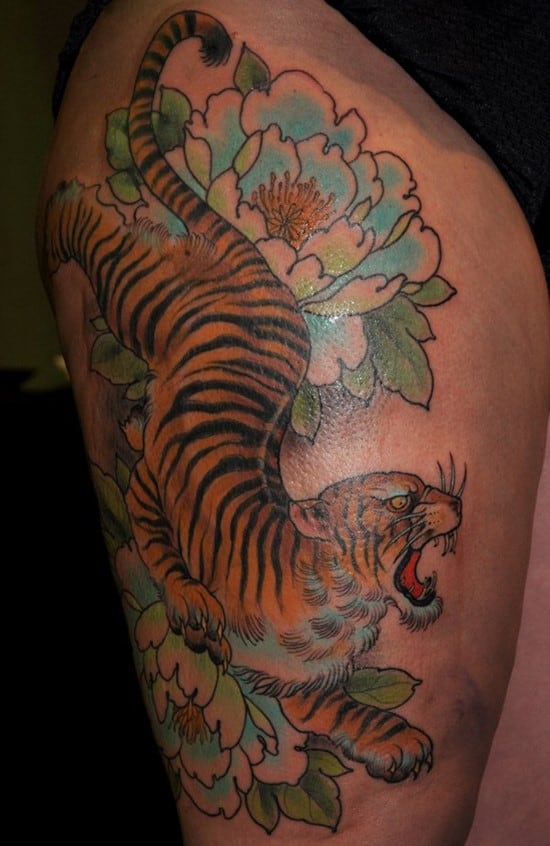 tiger and lotus flower thigh tattoo