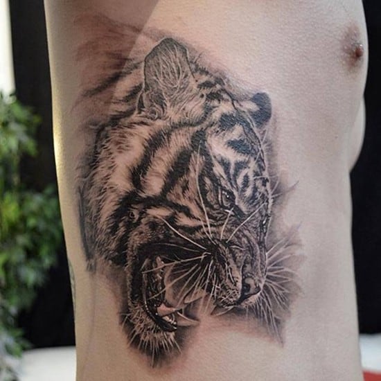 tiger on side of ribs tattoo