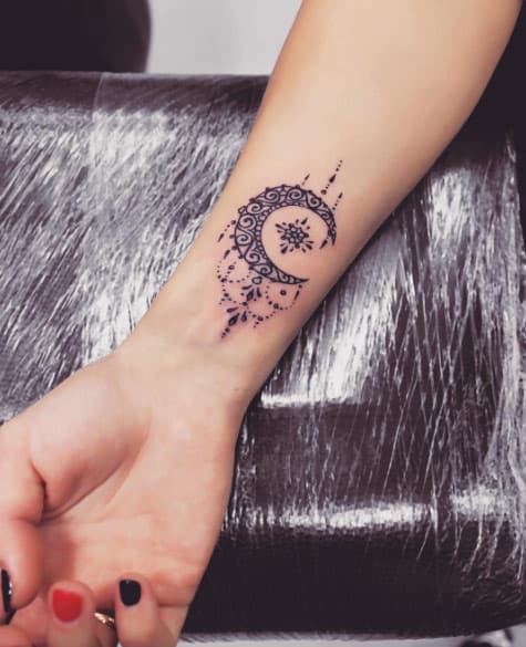 Ornament Moon Tattoo on Wrist by Anna Yershova