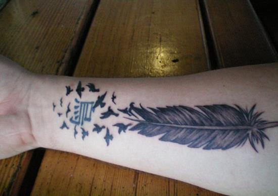 9-feather-tattoo-on-forearm