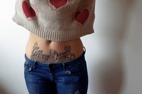 Black-words-stomach-tattoo