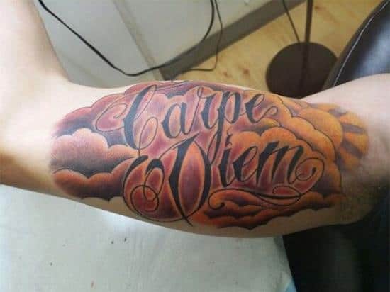 carpe diem and clouds arm tattoo design