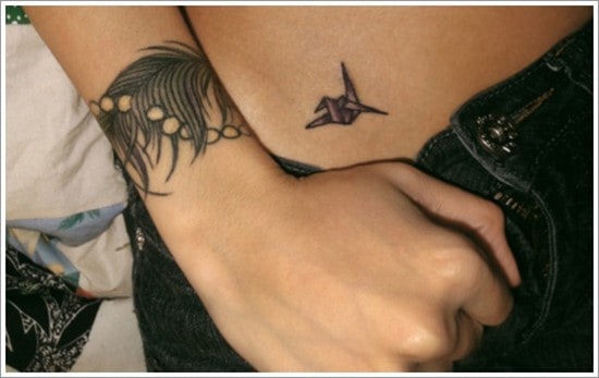 Feather-Tattoos-On-Wrist-Of-Girls