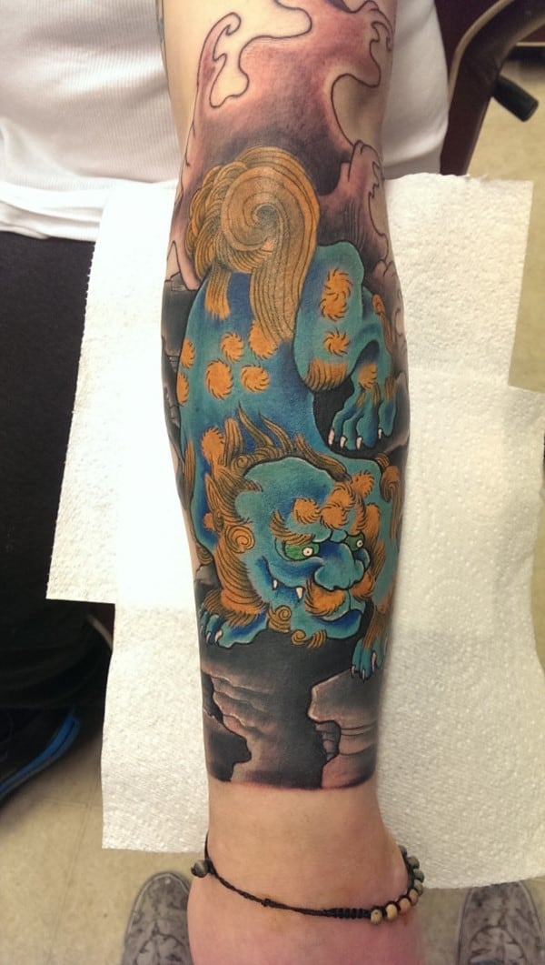 Fu-Dog-fore-arm-piece-by-Lee-Biggs-at-Woodys-Tattoo-Studio.-588x1040