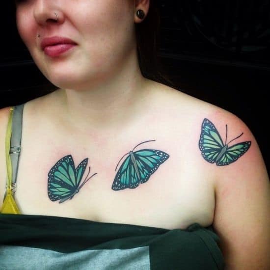 Green-and-black-butterfly-collar-bone-tattoos