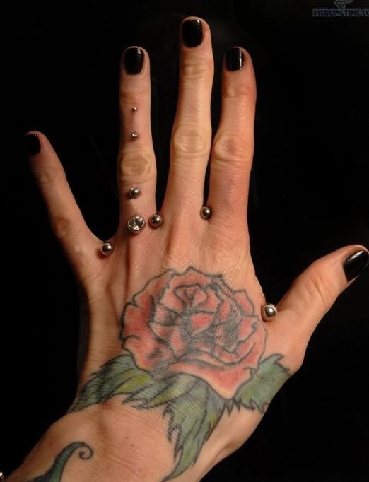Rose-tattoo-on-hand-Women-tattoos