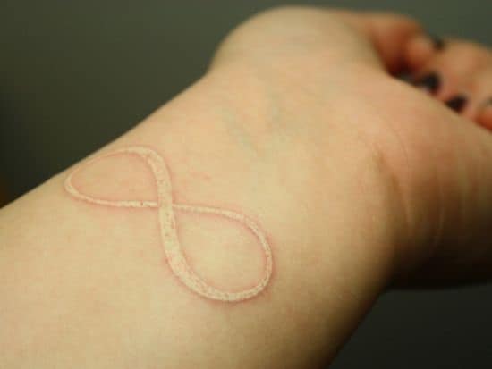 White-infinity-tattoo-on-wrist