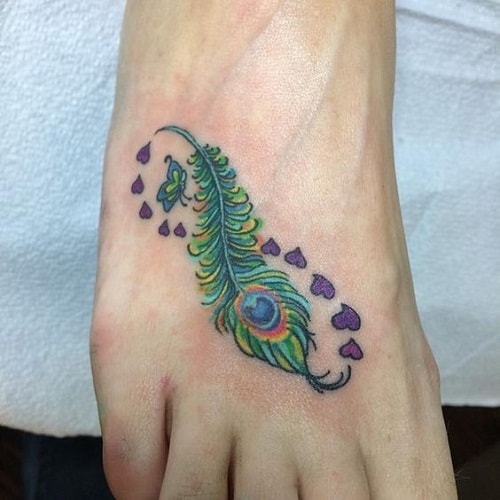 Foot Tattoo Peacock Feather And Small Violet Hearts