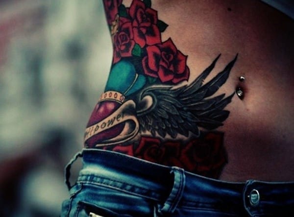 gun tattoos on hips for women