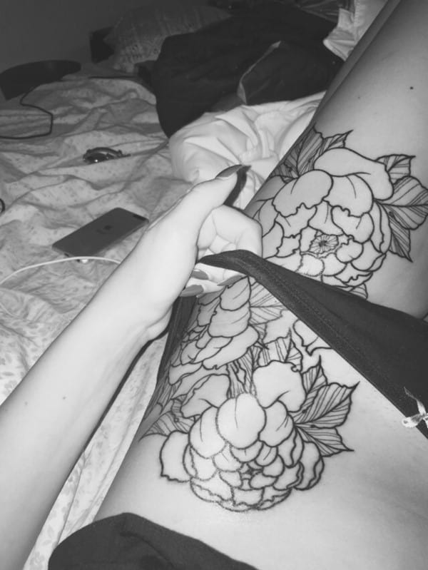 Fine line peonies tattoo on the hip and thigh