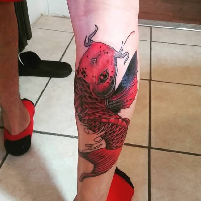 Black Ink Koi Fish Tattoo On Leg Calf