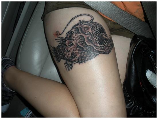 black angler fish tattoo on thigh koi-fish-tattoo-designs-1