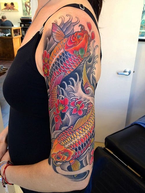 Koi Tattoos with Flowers and Waves