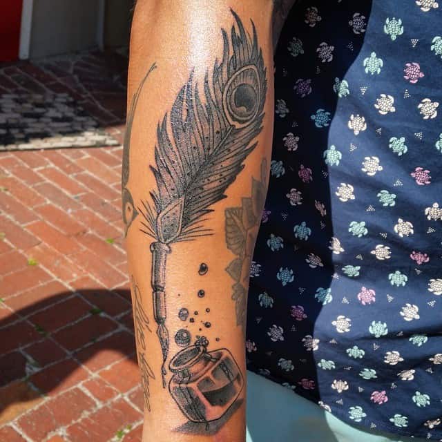 Ink Pot And Feather Tattoo On Arm by Nissen
