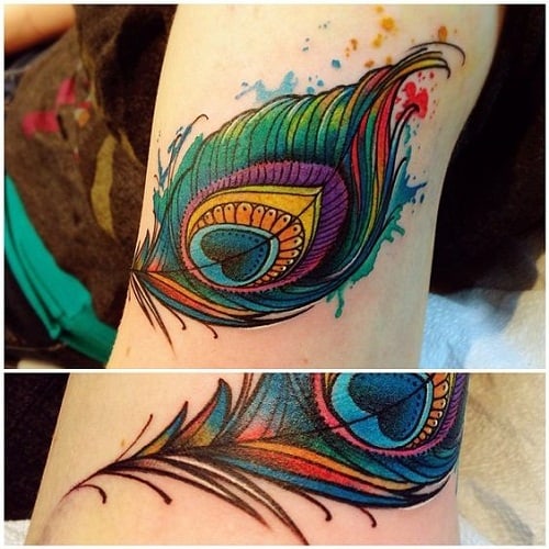 peacock feather tattoo on arm