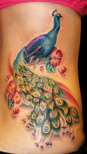 Peacock Tattoo With Red Flowers