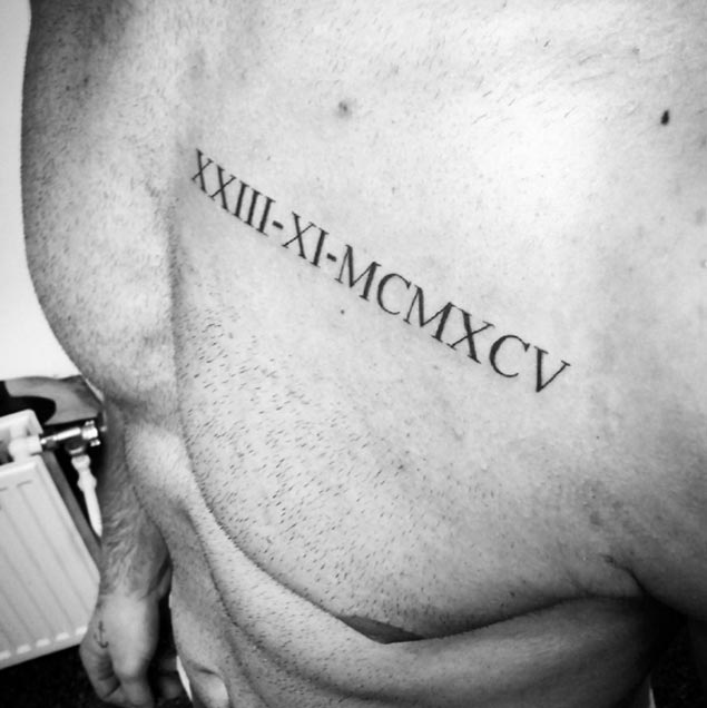 Roman Numeral Tattoo on Chest by Amilcar