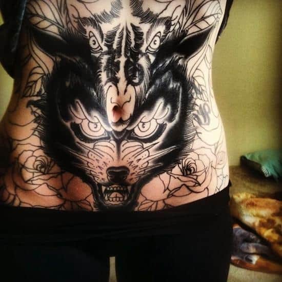 stomach-tattoo-ram-and-wolf