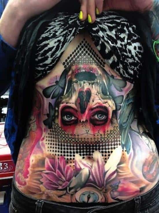 stomach-tattoo-skull-upside-down